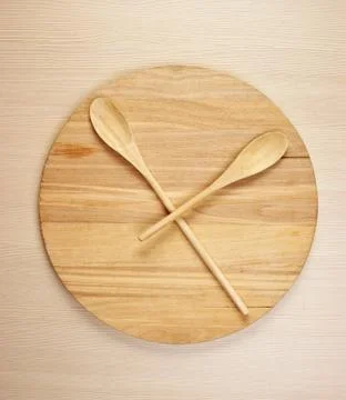 Stylized clock - cutting board and wooden spoons Stock Photos