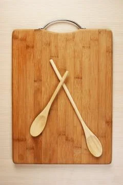 Stylized clock - cutting board and wooden spoons Stock Photos