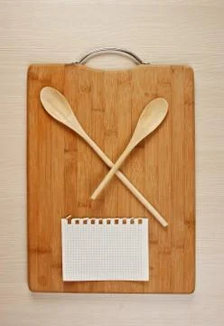 Stylized clock - cutting board and wooden spoons Stock Photos