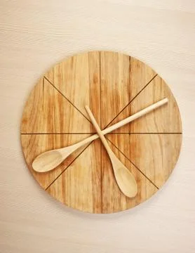 Stylized clock - cutting board and wooden spoons Stock Photos