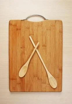 Stylized clock - cutting board and wooden spoons Stock Photos