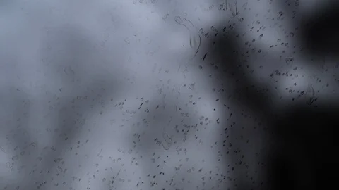 A Stylized depiction of raindrops falling on the  windshield of a moving car Video stock 98203476