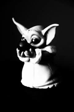 Stylized Figurine With Large Eyes and Dramatic Shadows- Germany Stock Photos