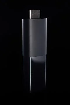 Stylized HDMI Streaming Device Against Dark Background Stock Photos