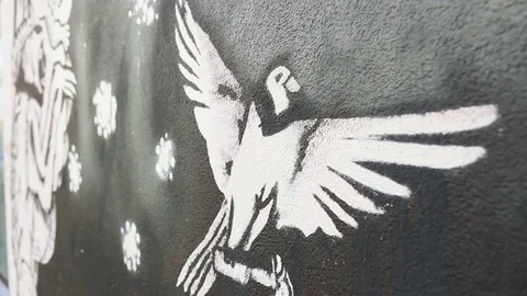 A stylized image of a flying white bird on a dark rough background Stock Footage 129709874