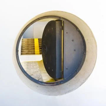 Stylized submarine hatch door Metal and concrete Stock Photos