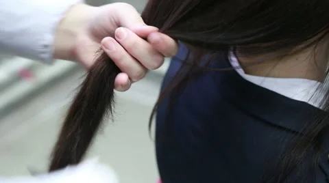 Stylst making hairstyle with a comb Stock Footage 48623287