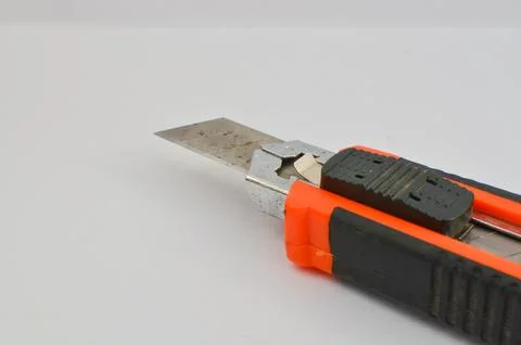 Stylus blade highlighted on clear surface. Essential tool for precise cuts .. 库存照片