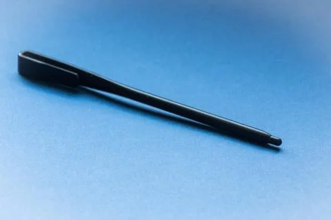 Stylus close-up on a blue background. Technologies. Convenience. Stock Photos