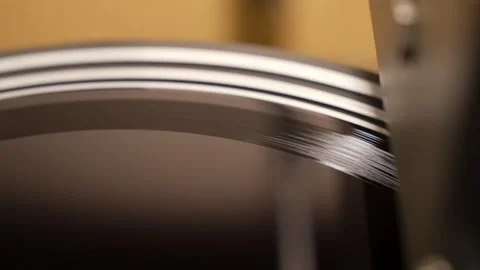Stylus precisely tracing grooves on a spinning vinyl record Stock Footage 317138081
