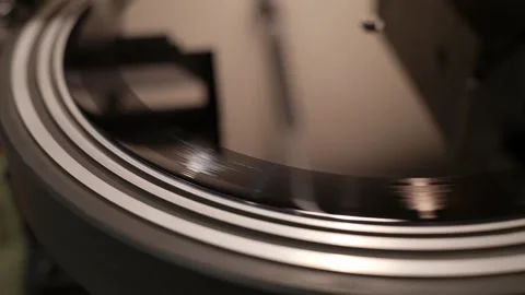Stylus precisely tracing grooves on a spinning vinyl record Stock Footage 317138093