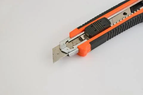 Stylus with a sharp blade on a light background. Precise and versatile cutt.. 库存照片