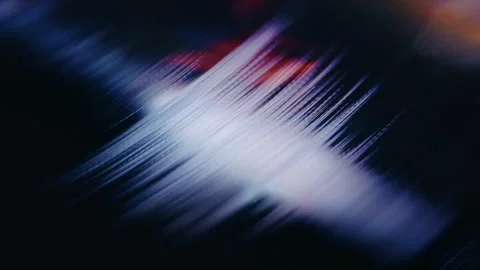 Stylus Tracking Vinyl Record Groove with Colorful Neon Reflection Stock Footage 345399196