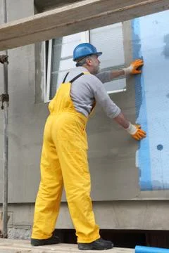 Styrofoam facade insulation, installing mesh Stock Photos