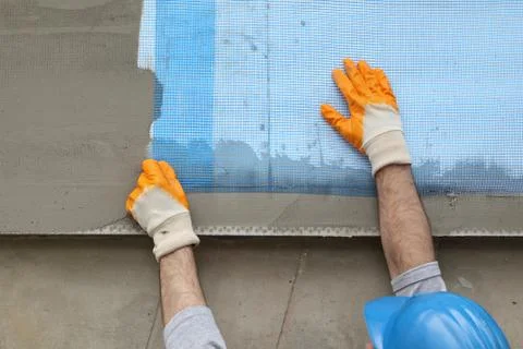 Styrofoam facade insulation, installing mesh Stock-Fotos