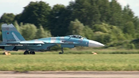 Su-27 plane is gathering speed on runway for take-off. Close-up. Video stock 110869366