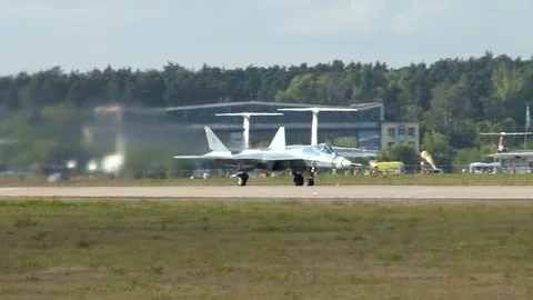 Su-57 fifth-generation fighter on runway begins to gain speed for takeoff. Stock Footage 115395153