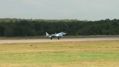Su-57 fifth-generation fighter lowers front landing gear on runway. Close-up. Stock Footage 115395174