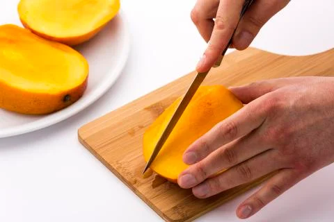 Subdivide the three mango slices Stock Photos