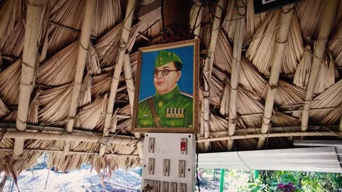 Subhas Chandra Bose Photo Frame Adorning Village Hut Pillar in Arunachal Pradesh 스톡 동영상 257210771