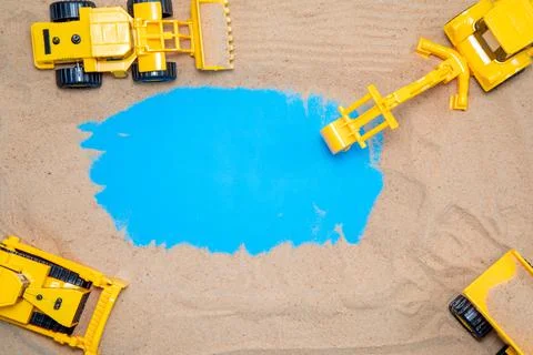 Subject of construction and development Toys tractors work in the sand Foto stock