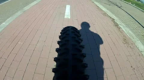 Subjective on bike with man shadow Stock Footage 10791885