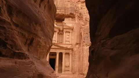 Subjective shot walking through the Siq Canyon revealing the Treasury of Petra Stock Footage 250551528