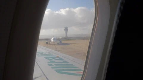 Subjective shot from the window moving airplane. Control Tower on background Stock Footage 112155212