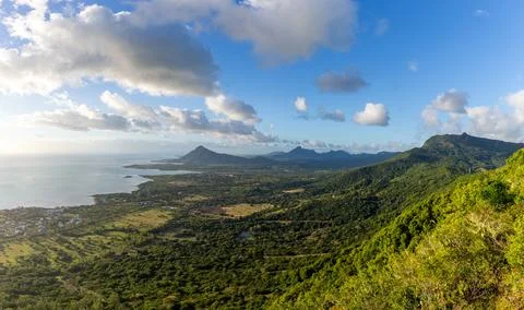 Sublime Point view of mountains and coastline in Mauritius at sunset Stock Photos