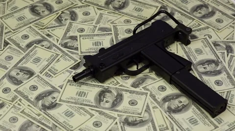 Submachine gun on dollars background Stock Footage 62424290