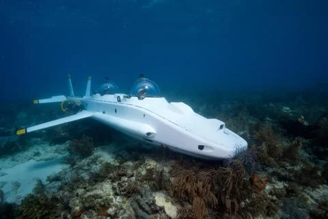 Submarine on the coral reef Stock Photos