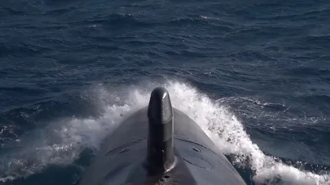Submarine in Motion, preparing to dive, cuts the blue water of the ocean Video stock 120753387