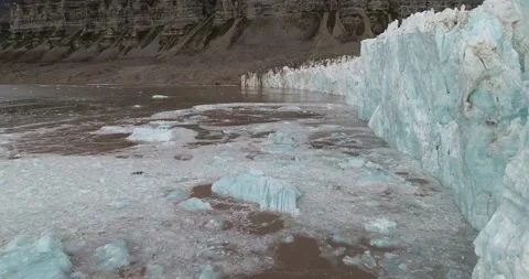 Submerged iceberg appearing floating in front of glacier on Svalbard Stock Footage 167516009