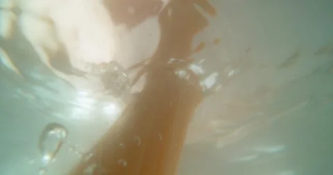 Submerged view of raw spaghetti falling into boiling water in slow motion i.. Stock Footage 337524754
