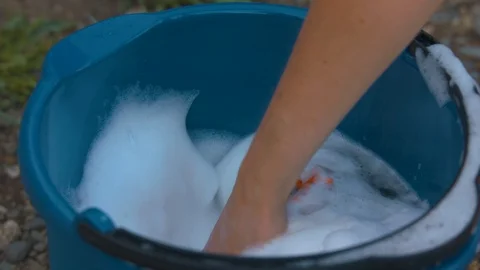 Submerging Sponge in Soapy Water in Slow Motion Stock Footage 92538623