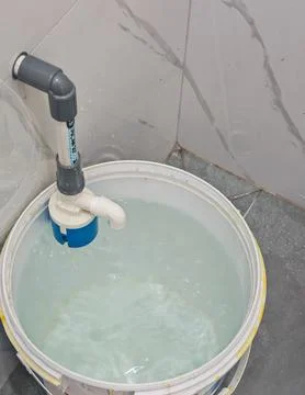 Submersible Water Pump System Inside Bucket for Plumbing Maintenance Stock Photos