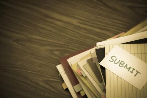 Submit; The Pile of Business Documents on the Desk Stock Photos