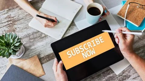 Subscribe button on device screen. Internet and digital marketing concept. Stock Photos