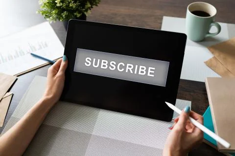 Subscribe button on device screen. Internet and digital marketing concept. Stock Photos