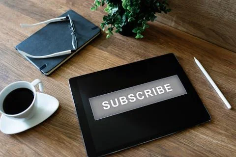 Subscribe button on device screen. Internet and digital marketing concept. Stock Photos