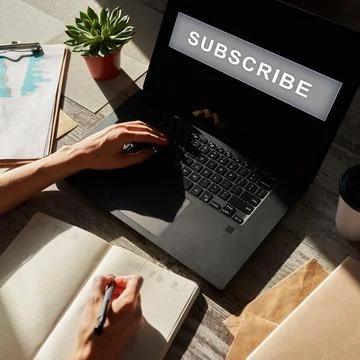 Subscribe button on device screen. Internet and digital marketing concept. Stock Photos