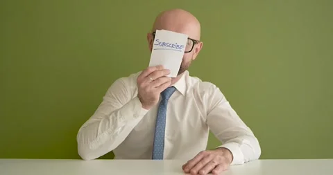 Subscribe - A man presents a note with the word Stock Footage 267089851