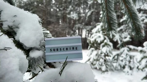 Subscribe message on a letter light box with snowfall background Stock Footage 260605874