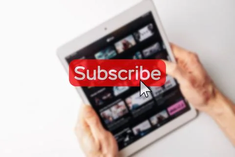 Subscription plan. Red online video subscribe button. Internet service on lap Stock Photos