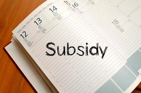 Subsidy write on notebook Stock Photos