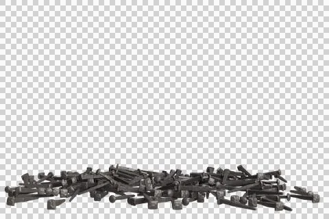 A substantial heap of dark, worn, metallic nails or spikes lies scattered Stock Photos