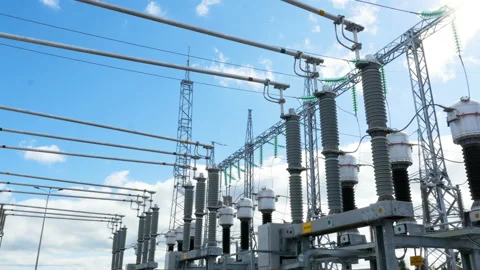 Substation converts electrical energy under sunlight Stock Footage 90709026