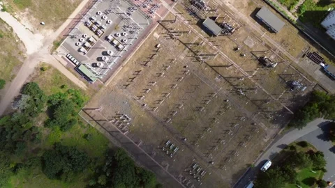 Substation distributing electricity at forest. Perfect aerial view flight drone Vídeo Stock 315474217