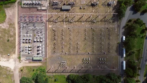 Substation distributing electricity at forest. Smooth aerial view flight drone Vídeo Stock 315474276