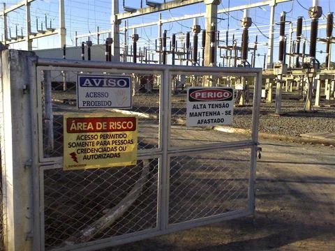 Substation gate with danger warnings Stock Photos